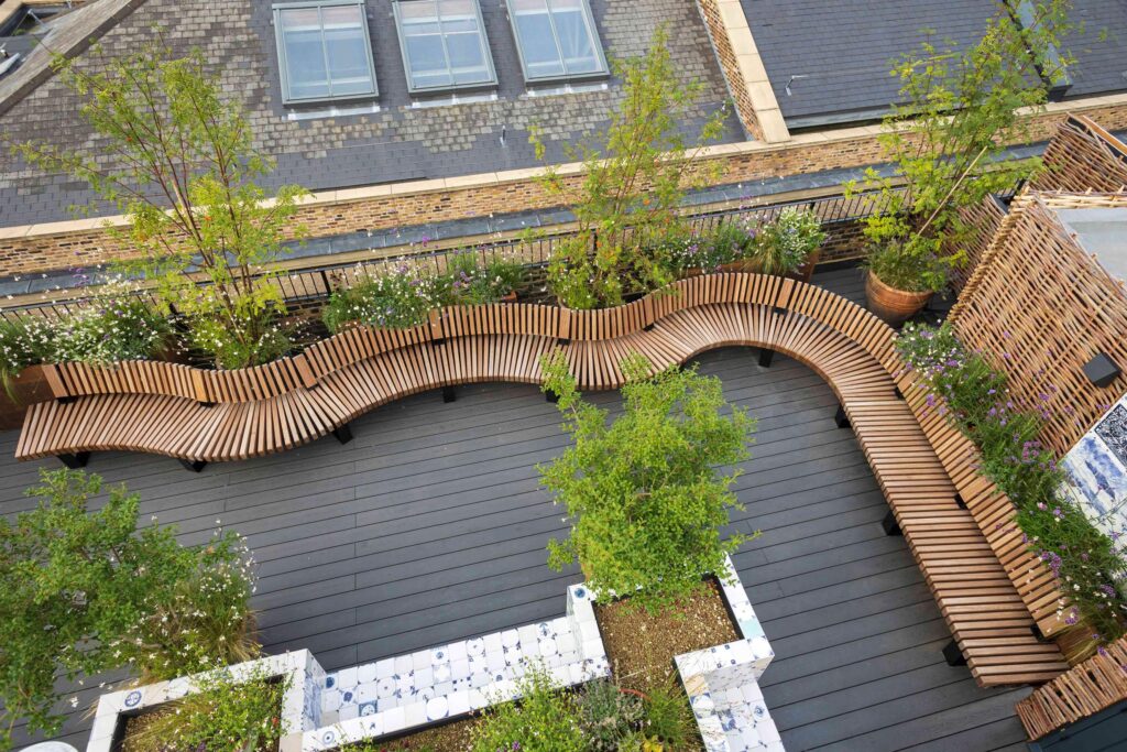Curved railroad seat on the conduit club rooftop