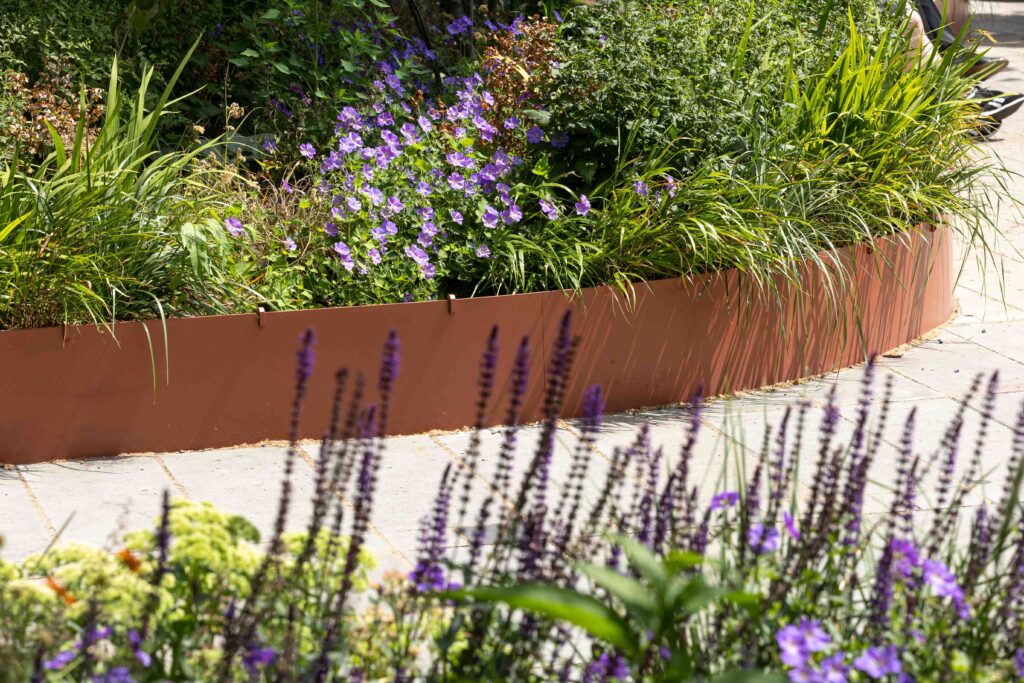 Low level planter with plants and greenery