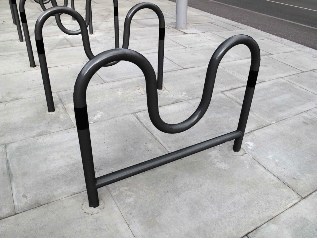 Morden cycle stands in black in a row on the high street